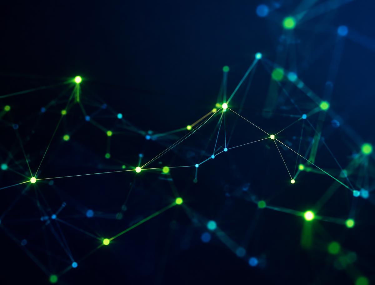 Abstract visualization of connected network nodes glowing in green and blue on a dark background